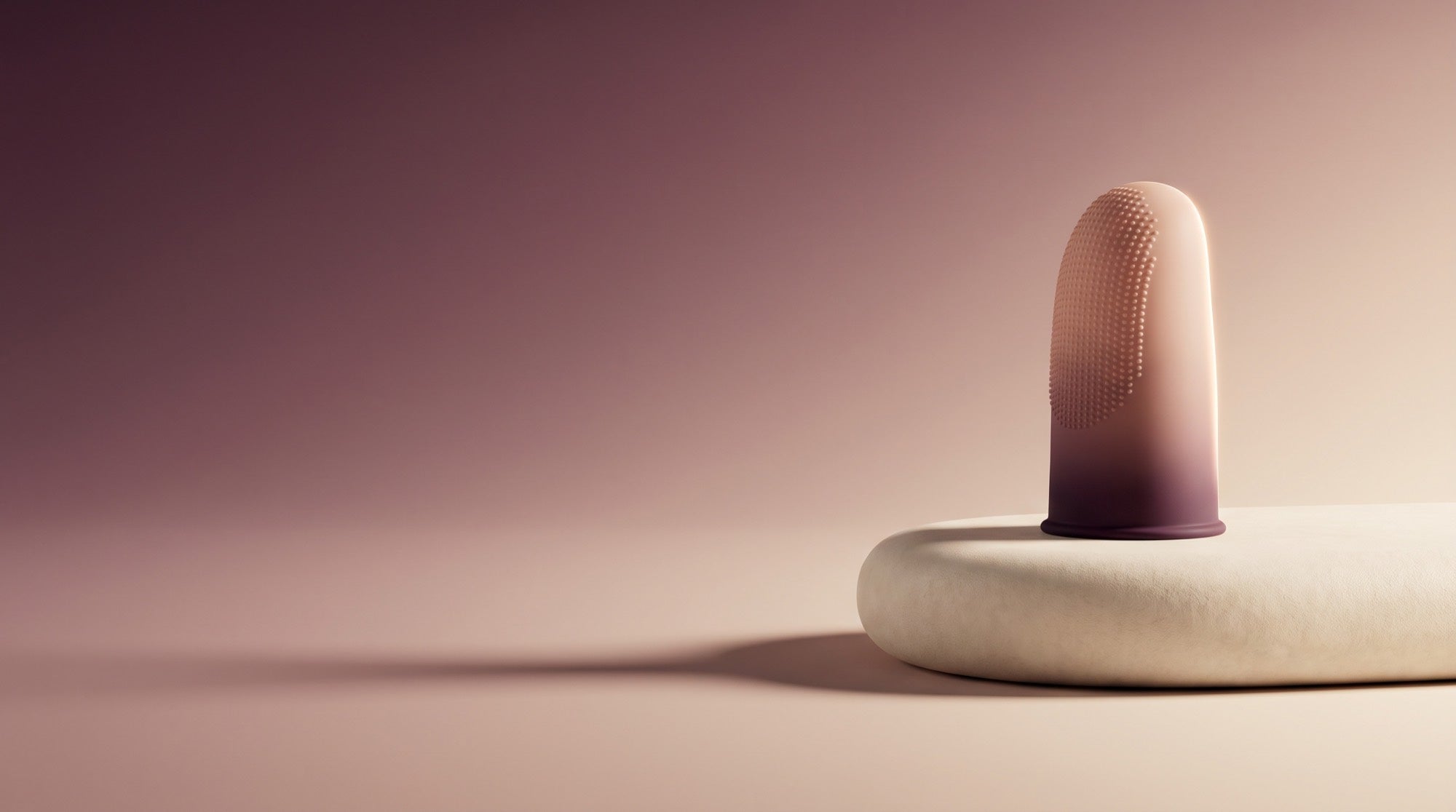 FRISSON textured silicone touch sleeve on a cream pedestal