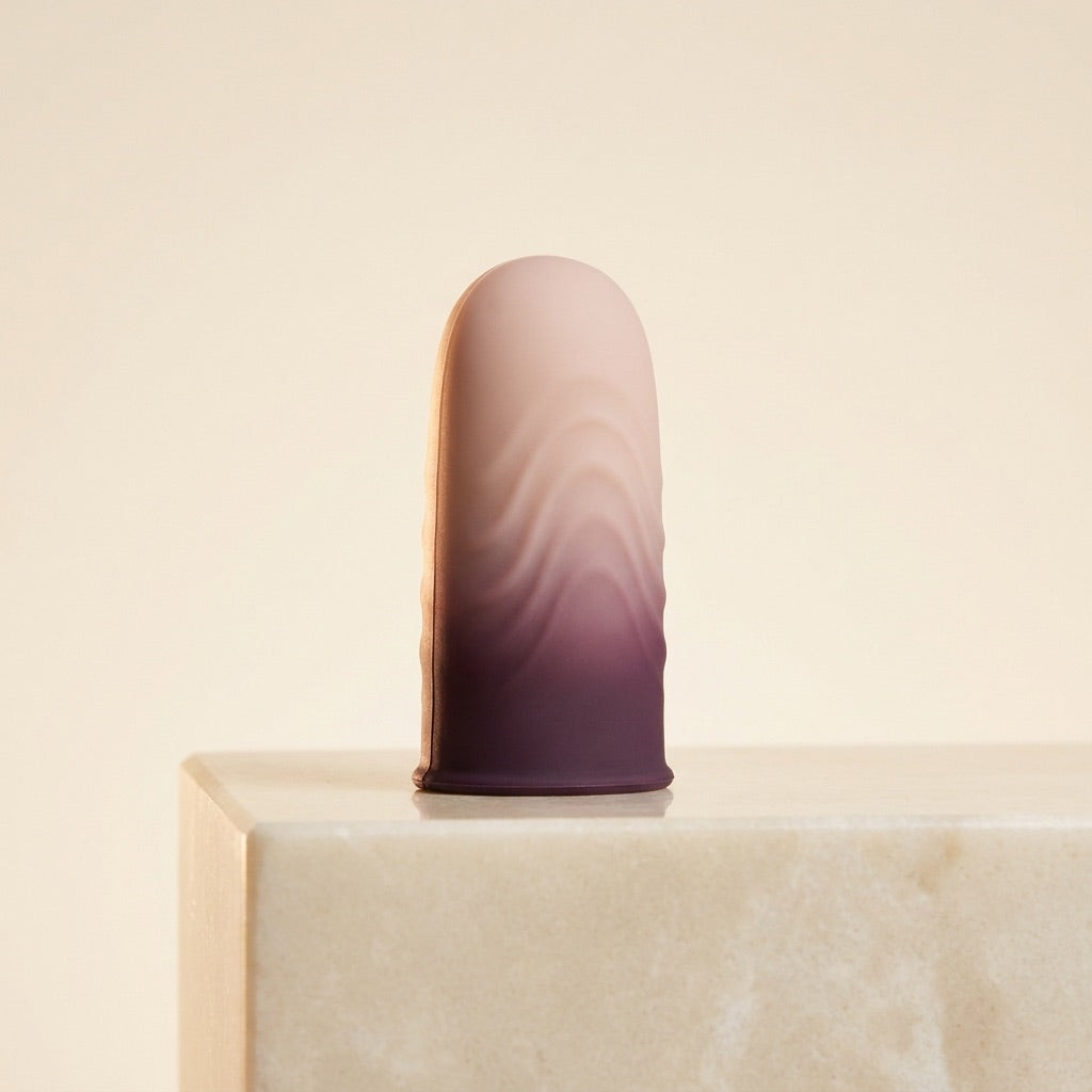 FRISSON touch sleeve on a cream pedestal